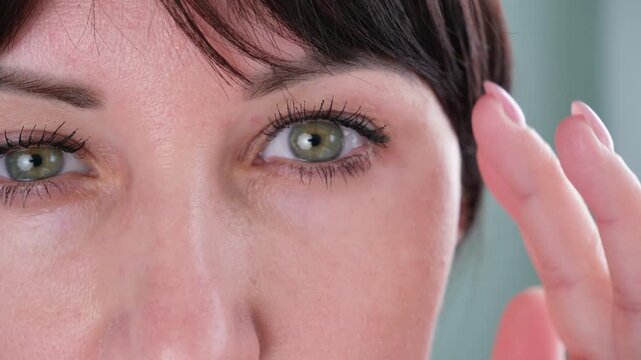 The woman has a drooping eyelid
