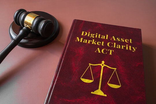 Digital Asset Market Clarity Act red law book with judge gavel on brown background, cryptocurrency regulation concept