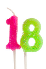 Fototapeta premium Eighteen birthday candles in pink and green for celebrating a special milestone