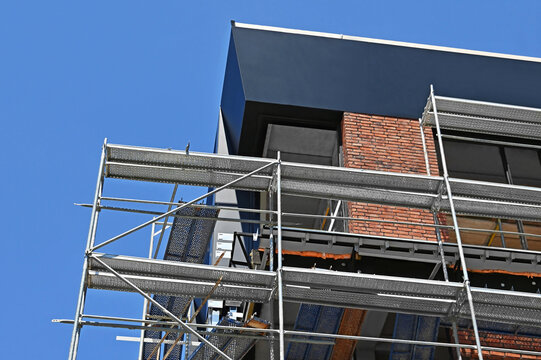 Construction site with scaffolding and brick work