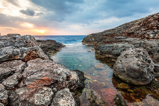 Clear rocky sea inlet in scenic Cala d'Or, Mallorca, Spain.