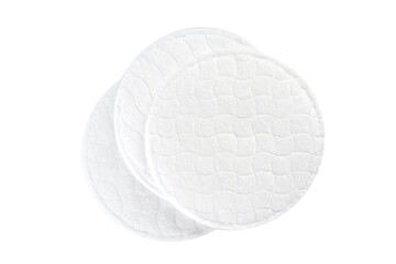 Round cotton pads stacked on a white background © fotofabrika
