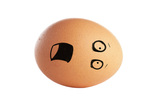 Egg with surprised face design lying on a flat surface