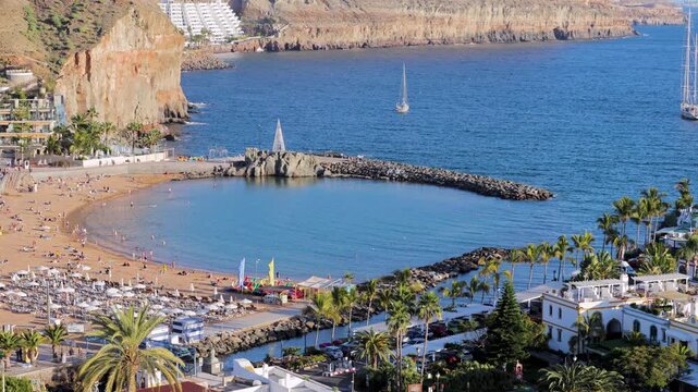 Paniramic view of Playa de Mogan, harbor and colorful buildings in the old town of Puerto de Mogan, Gran Canaria, Canary Islands, Spain, Atlantic, Europe