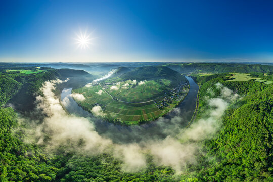 Aerial view shows the Mosel river meander in Mesenich in sunlight