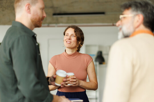 Businesspeople enjoy a coffee break during a networking conversation