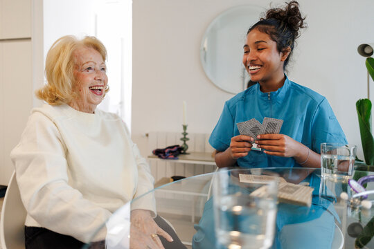 Caregiver providing support and companionship to senior at home