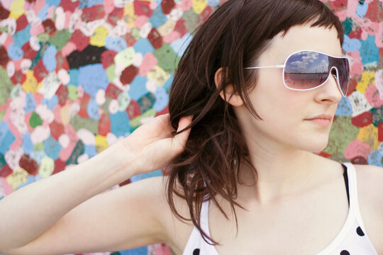 Young woman wearing sun glasses, portrait