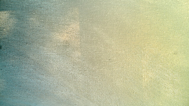 Textured teal and pale yellow background with fine horizontal ridges