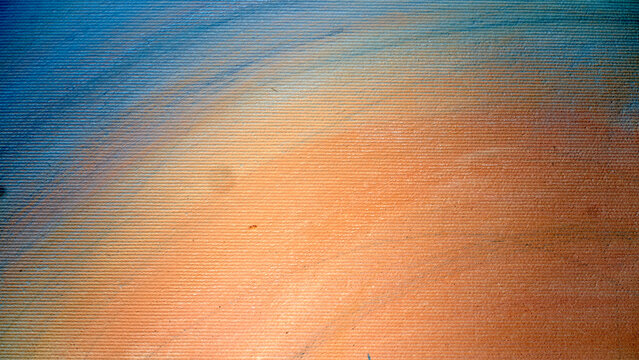 Textured blue and orange background with fine horizontal ridges