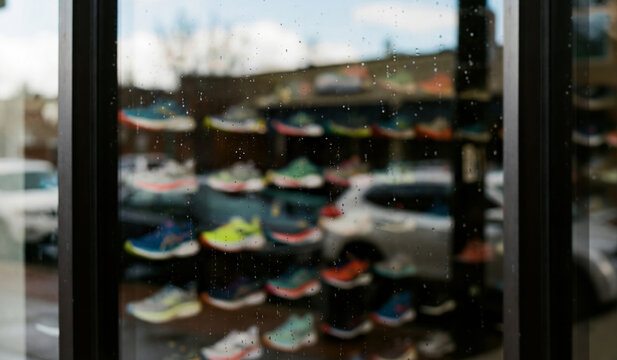 Close-up on a window glass of a running store for a logo Mockup. Generative ai