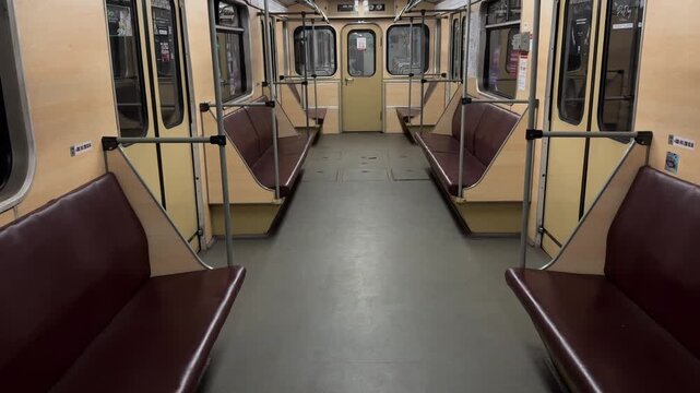 Empty subway train carriage interior with seat shows urban transport and city transit. Public transport, daily commute, metro travel, passenger rail, city life, underground railway and urban mobility.