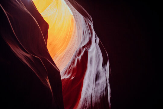 Illuminated sandstone rock walls inside antelope canyon slot canyon