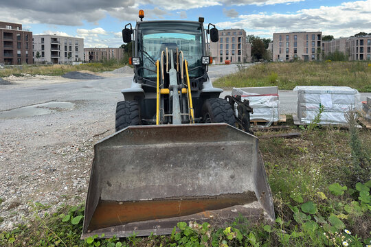 Construction loader at a building site in progress