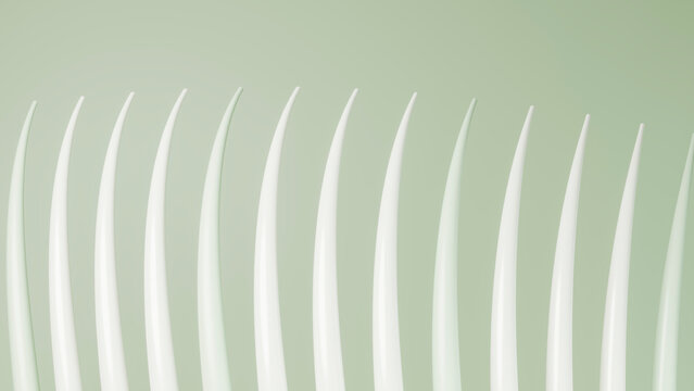 Row of white plastic forks lined up on green background