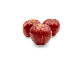Three fresh red apples arranged together on a transparent background, showing glossy skin, natural stems, and healthy fruit texture. © Mukta