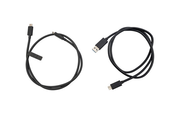 Two black sub charging cables with reversible connectors, neatly coiled and isolated on a transparent background.