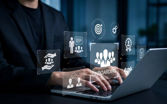 Person in dark suit typing on laptop with glowing digital onboarding interface and business