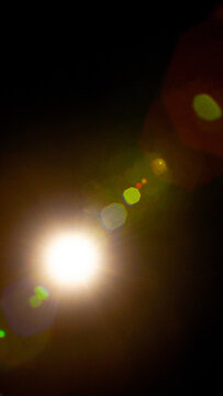 Sun flare on the black background