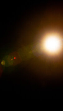 Sun flare on the black background