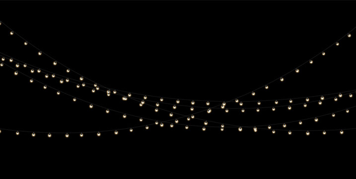 Decorative string lights hang in elegant, overlapping arcs against a dark background. The small bulbs emit a warm, soft glow with gentle halos. This setup creates an inviting ambiance for.