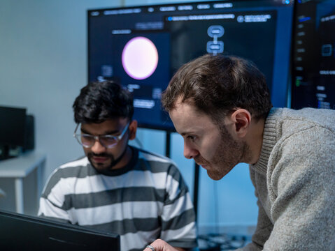 Software engineering use computer working development office are assisting algorithm systems or verifying code. Programmer teamwork using artificial intelligence on laptop analysis or writing coding