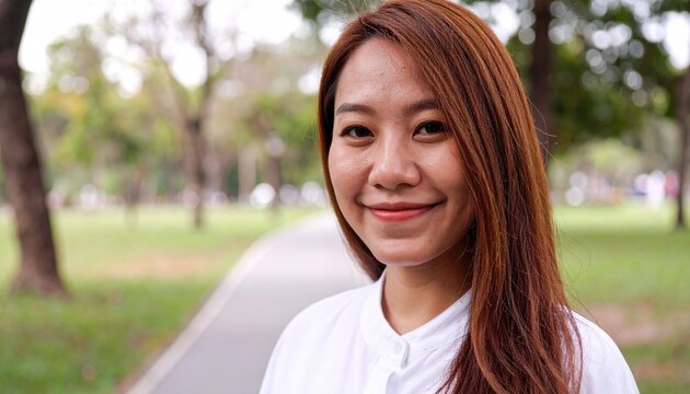 Portrait of young woman on public park 