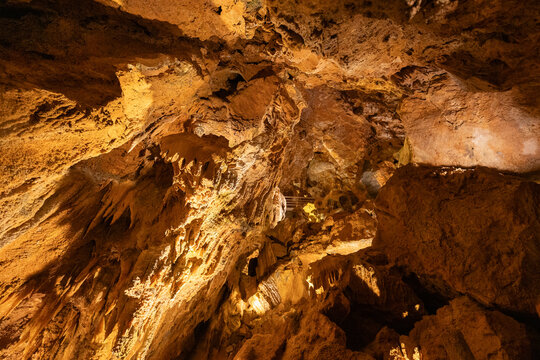 Exploration of a cave interior with interesting rock formations and lighting effects