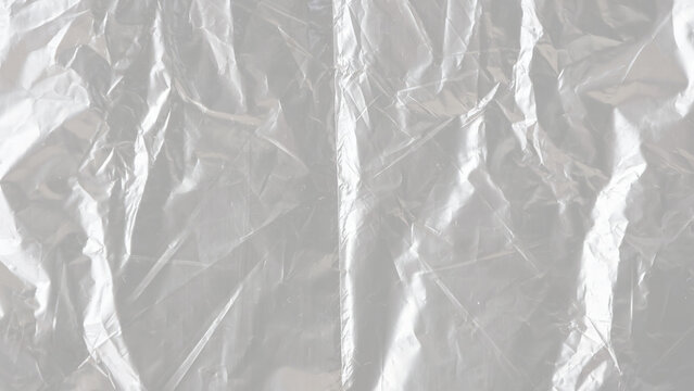 package mockup, plastic wrap transparent texture overlay effect. polyethylene packaging of vinyl wrap. shrink crumpled plastic bag sleeve.