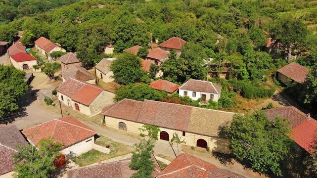 Aerial around view of old rustic vintage houses with wine cellars in Rogljevacke pivnice in Negotin region of Serbia, 4k