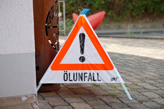Oil spill accident warning sign, german language, hazard emergency, danger zone, road barrier, traffic safety, fire department Trier, Germany