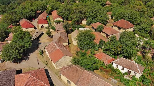 Aerial around view of old rustic vintage houses with wine cellars in Rogljevacke pivnice in Negotin region of Serbia, 4k