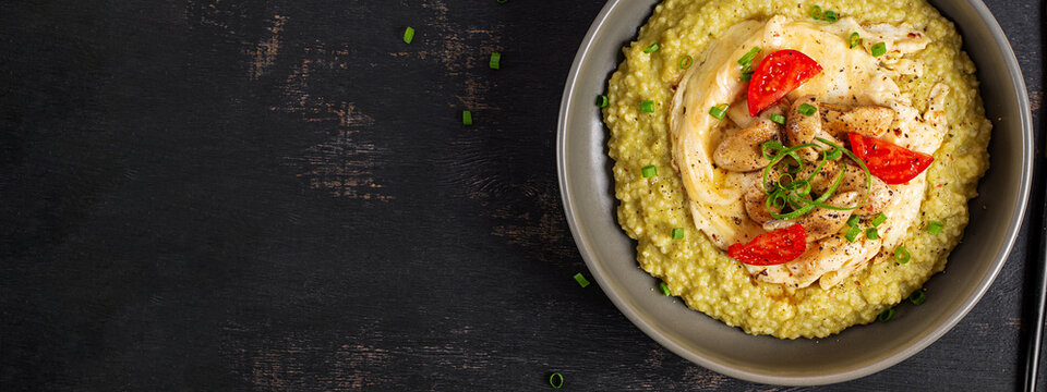 Creamy Millet Porridge with Pesto, Omelet and Champignon Mushrooms. Top view, banner