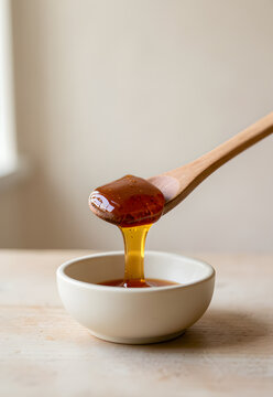 Chestnut honey on a wooden spoon