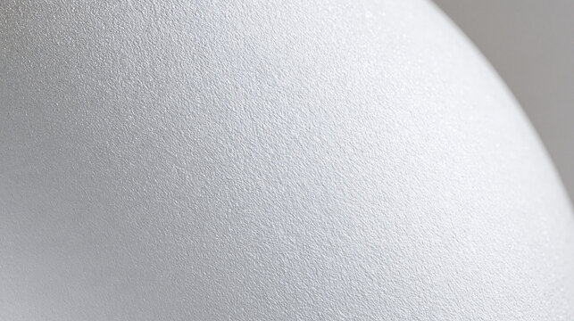 Macro close up of white eggshell texture with soft light   