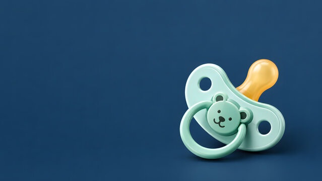 Minimalist cute mint green baby pacifier with a bear face icon isolated on a dark blue background