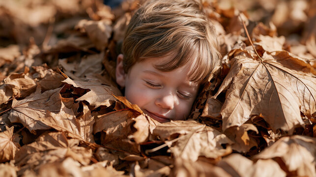 Close up of a toddler's face pressed into a pile of autumn leaves gathered in a backyard, eyes scrunched shut, completely buried to the chin, outdoor seasonal sensory play,