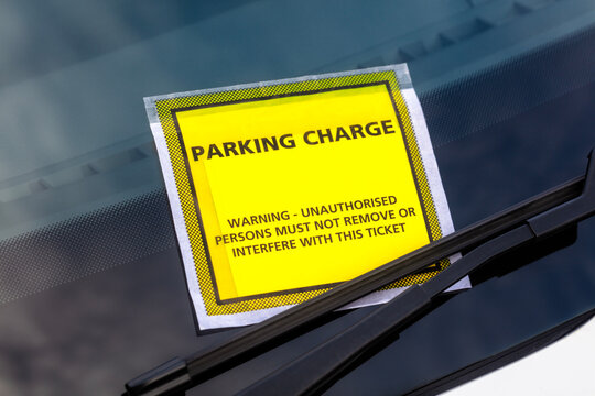 Parking charge penalty notice parking fine attached to windscreen