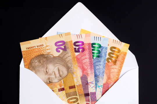 South African rand in a white envelope