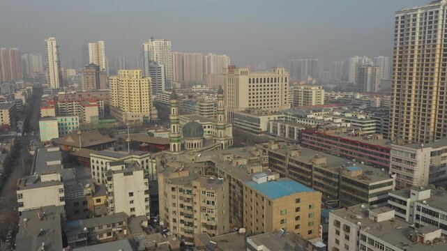 Drone shot of famous Dongguan mosque in central residential neighborhood of Xining, Islamic religion in China