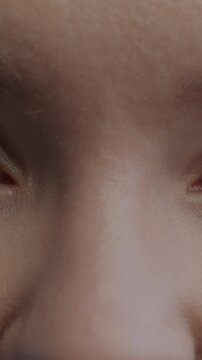 Close-up portrait of beautiful girl's eyes looking at camera with joyful expression. Human body part and positive emotion concept.