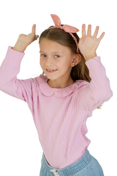 Cute little girl making funny faces isolated on white background, studio portrait