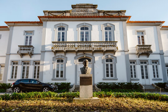 Riba de Ave, Portugal - November 18, 2025: Narciso Ferreira Hospital building with a statue of Raul Ferreira in front