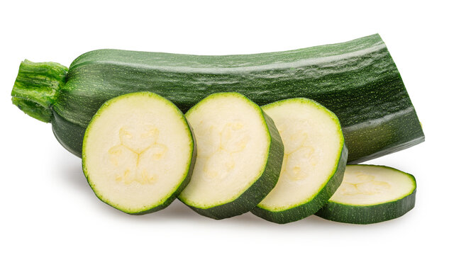 Fresh zucchini with zucchini slices isolated on white background. File contains clipping paths.