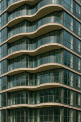 Fototapeta premium High rise building facade with repeating curved balconies