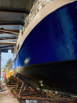 Fishing vessels undergoing maintenance at a shipyard in Ballstad, Lofoten, Norway