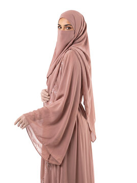 Muslim Woman in Dusty Rose Pink Abaya and Matching Niqab Isolated on Black Background   