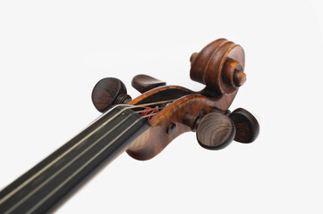 Close Up of a Violin Scroll and Tuning Pegs © dj