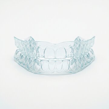 Clear dental night guard for teeth grinding protection. 