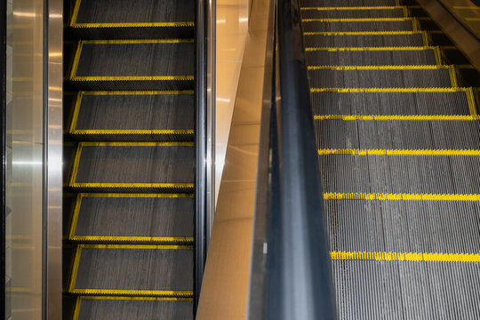 Modern Indoor Escalators With Yellow Safety Edges